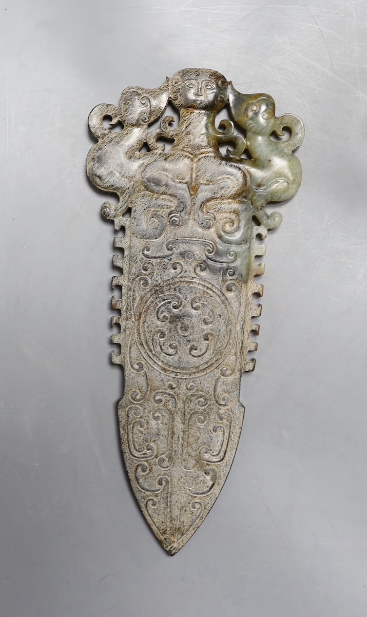 A 20th century Chinese archaistic jade carving, model of an axe head, 30.5 cms long.